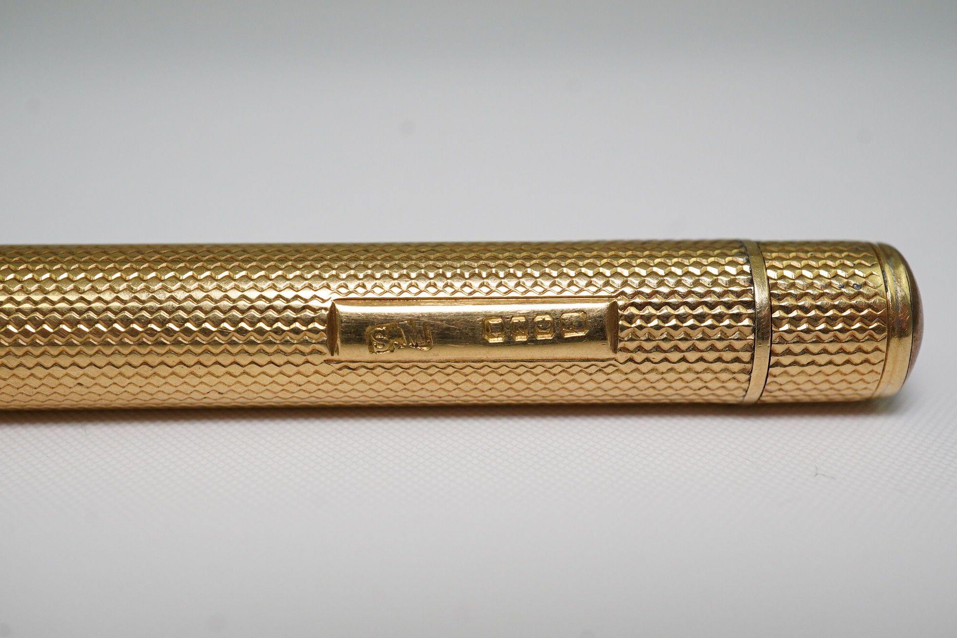 A late Victorian engine turned 18ct gold cased combination propelling pen and pencil, by Sampson Mordan & Co